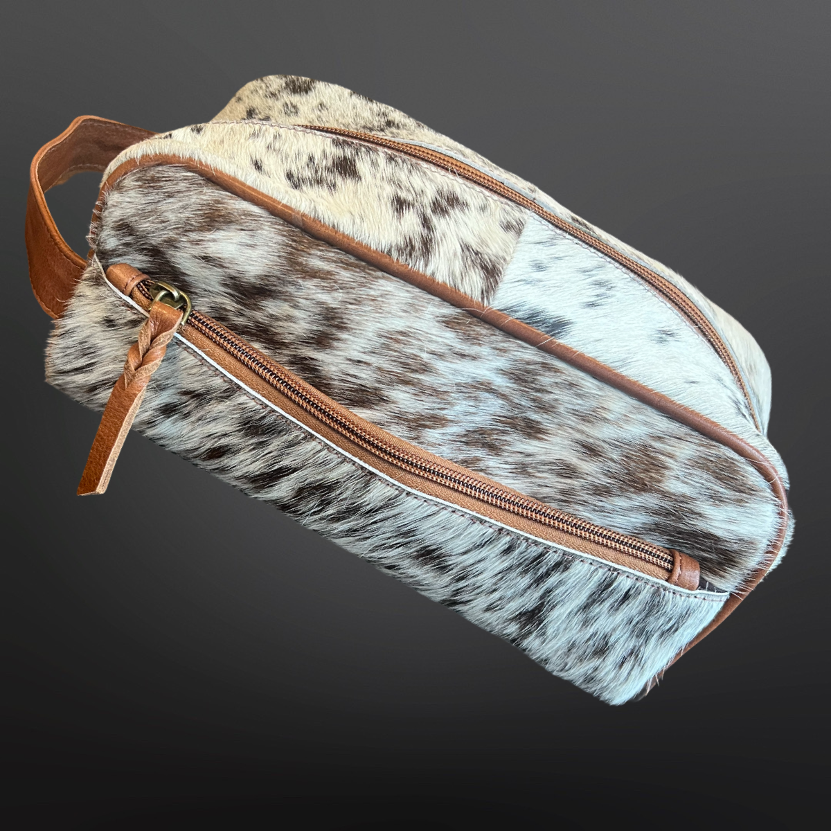 Cowhide toiletry bag with brown leather accents