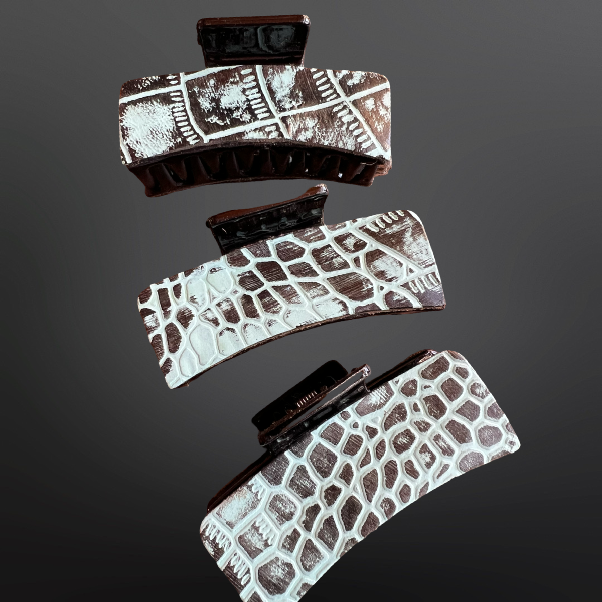 Embossed hair clips  on a dark background