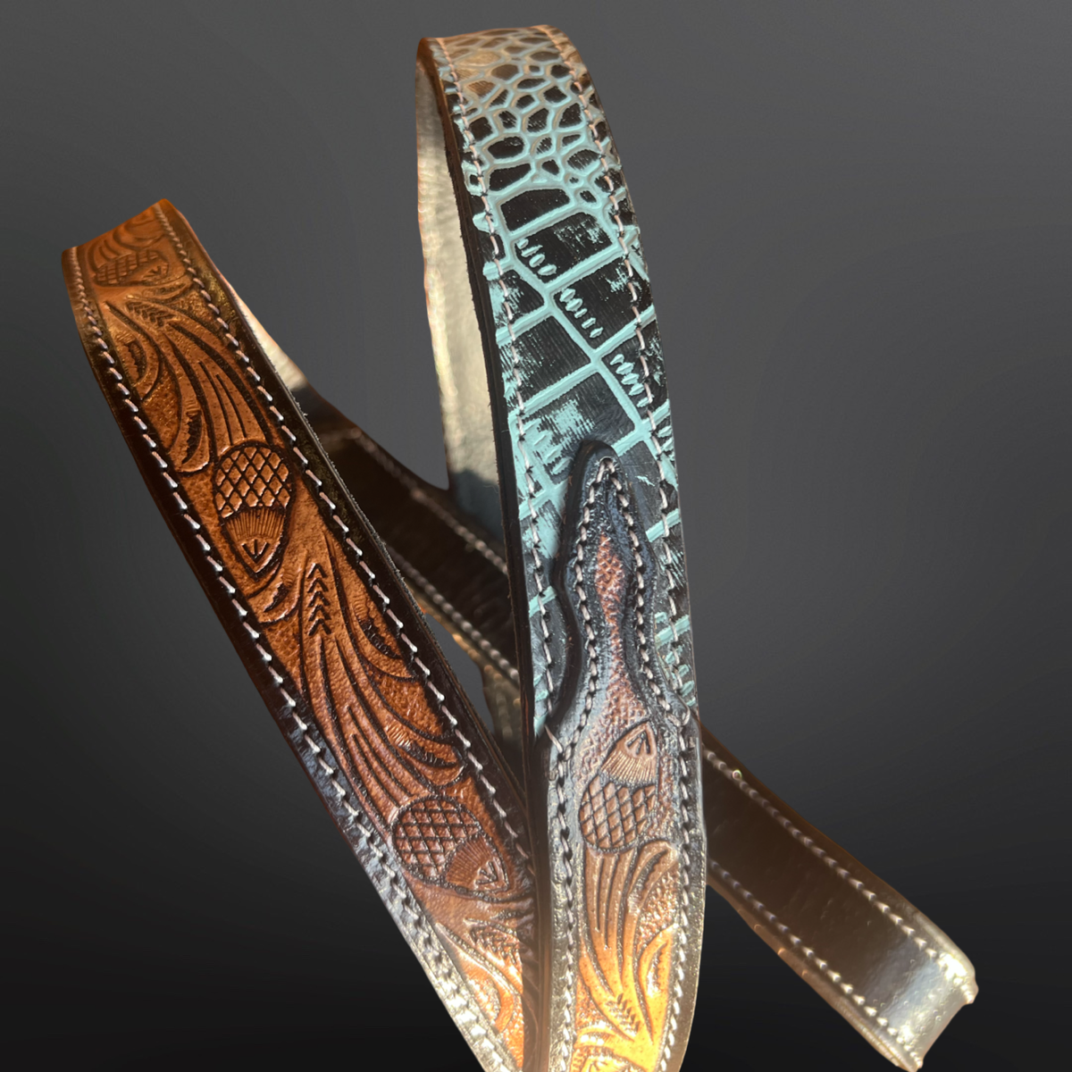 Tooled leather dog collar with turquoise embossed leather on a dark background