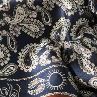 Navy blue scarf with white paisley pattern