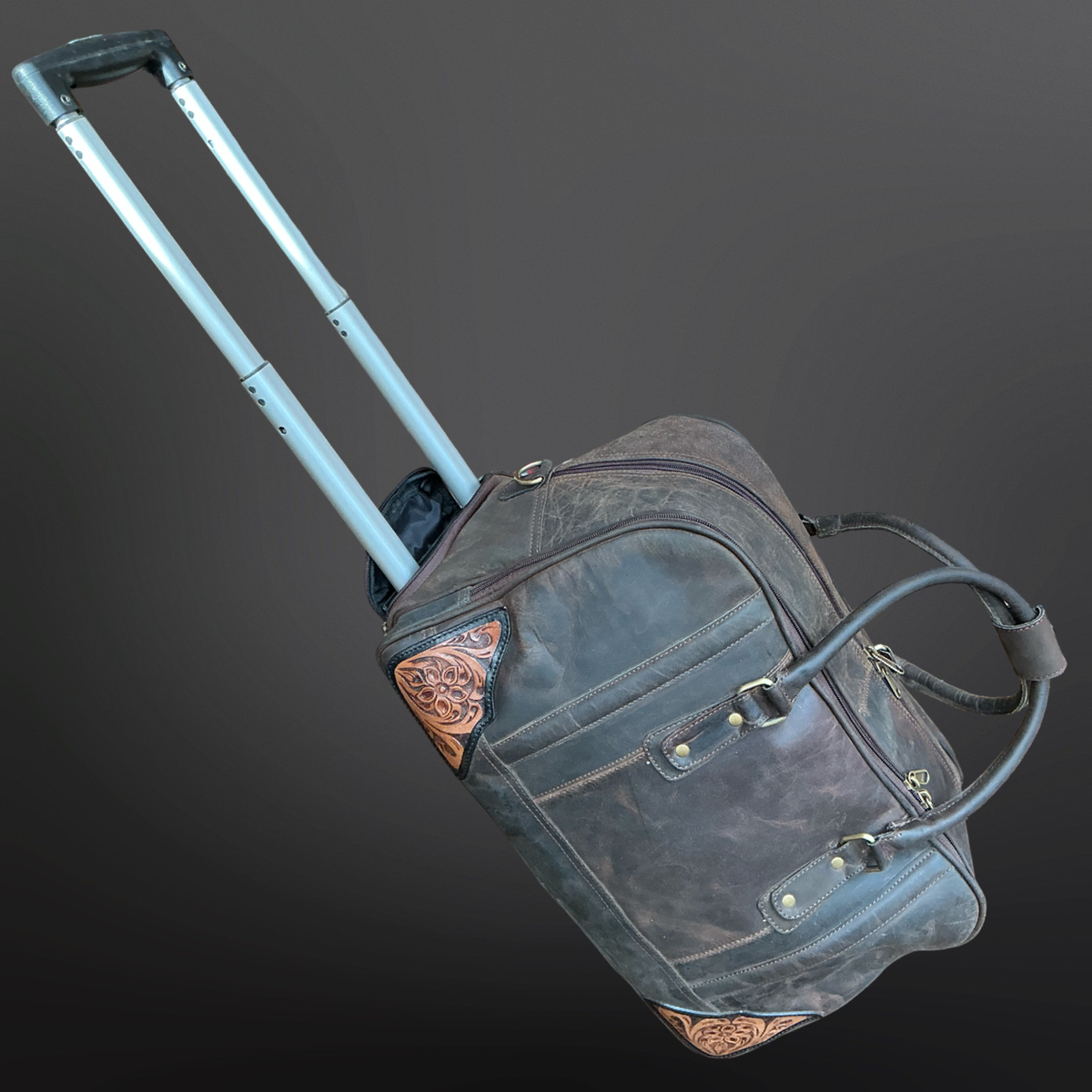 Gray wheeled duffle with decorative elements on a dark gray background
