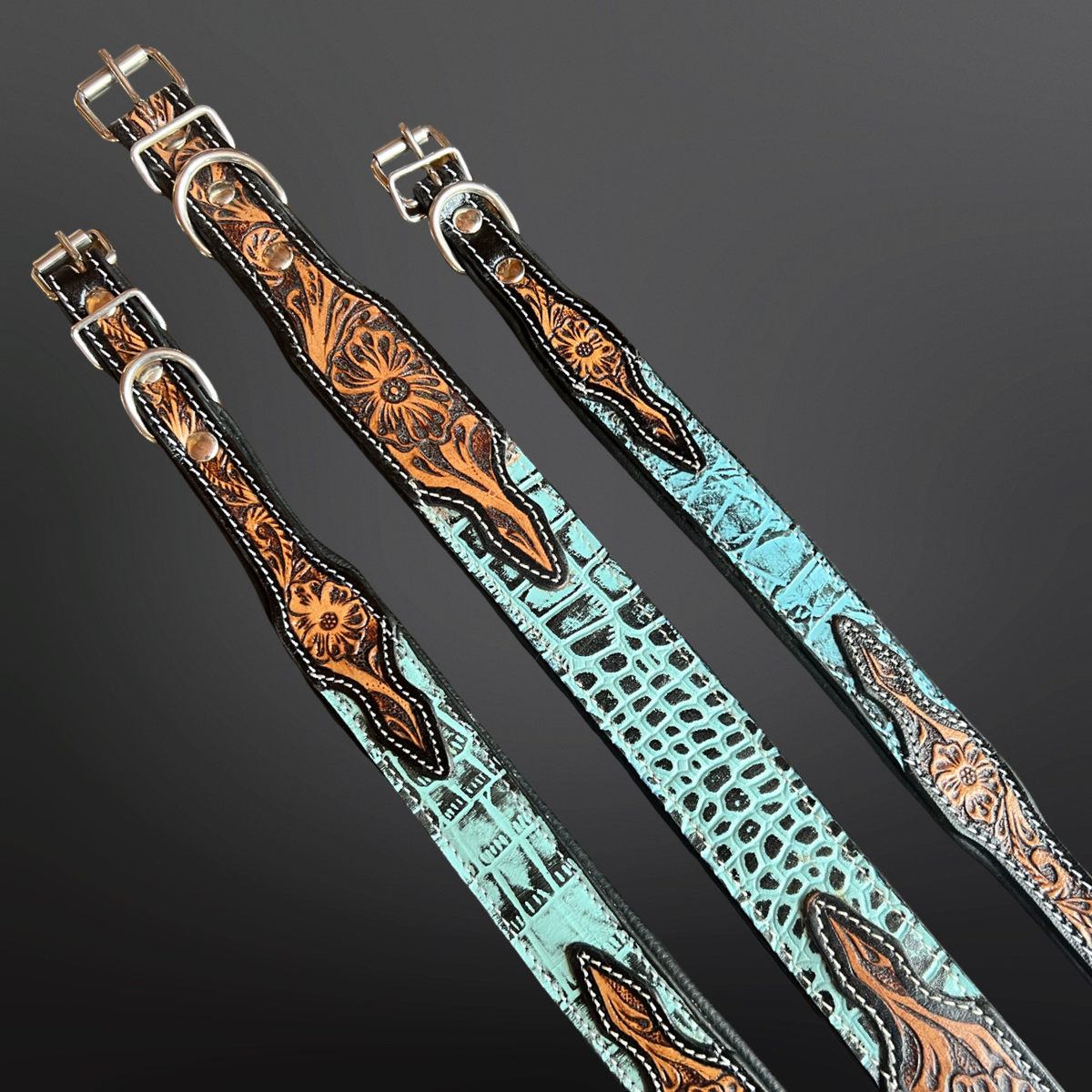 Decorative western leather dog collars with tooled leather patterns and turquoise embossed leather on a dark background