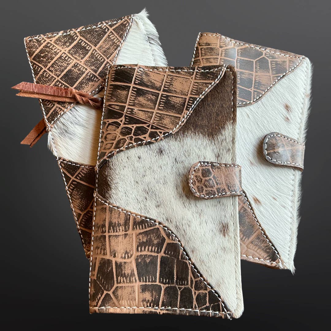 Cowhide leather wallet with geometric pattern on a dark background